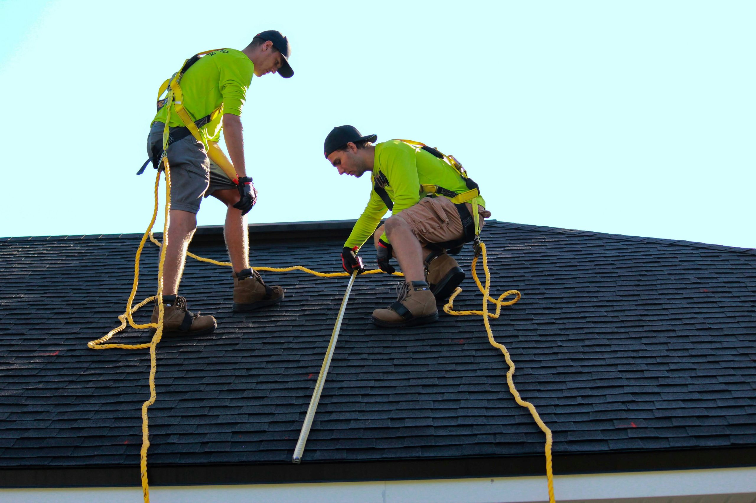contractors inspecting a roof
